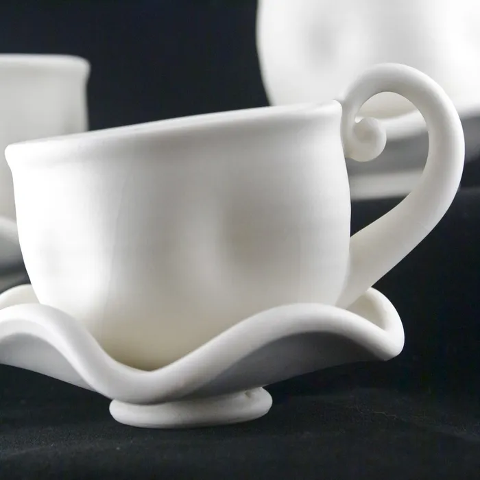 Whimsical teacups, frosted white