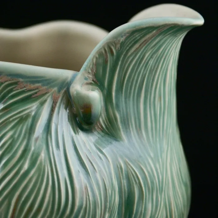 carved pitcher, detail